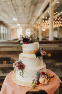 naked wedding cake with flowers